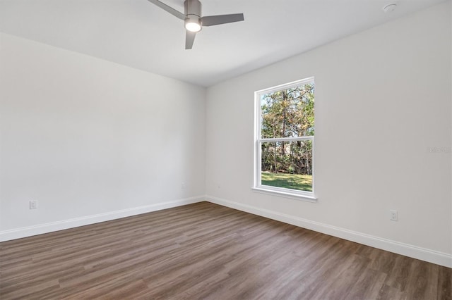 52 Pershing Ln, Palm Coast, FL 32164 - spare room featuring dark wood finished floors, ceiling fan, and a smoke detector