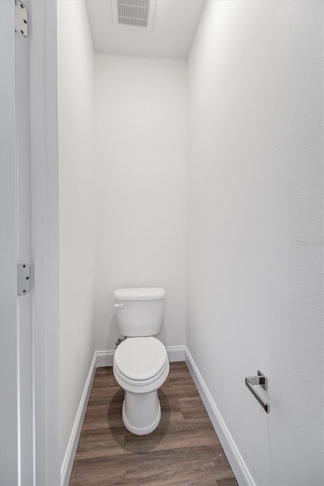 52 Pershing Ln, Palm Coast, FL 32164 - bathroom with wood finished floors and baseboards