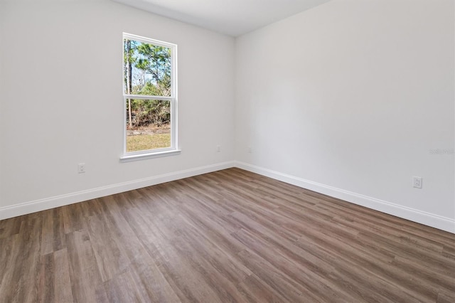 52 Pershing Ln, Palm Coast, FL 32164 - unfurnished room featuring baseboards and wood finished floors