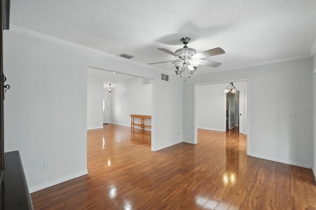 131 Boulder Rock Dr, Palm Coast, FL 32137 - unfurnished room featuring ceiling fan, wood-type flooring, a chandelier, a textured ceiling, and crown molding