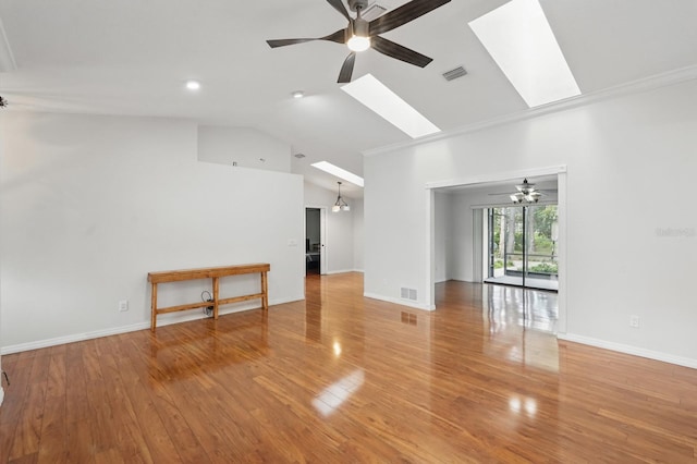 131 Boulder Rock Dr, Palm Coast, FL 32137 - unfurnished room with a ceiling fan, lofted ceiling, a skylight, wood finished floors, and crown molding