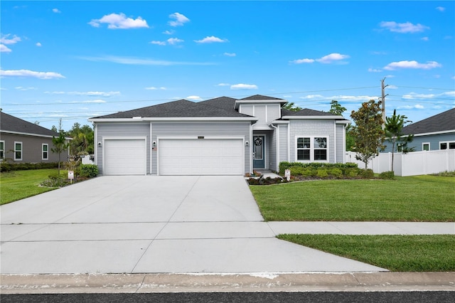 2137 Raglan Cir, Ormond Beach, FL 32174 - view of front of house with an attached garage and driveway