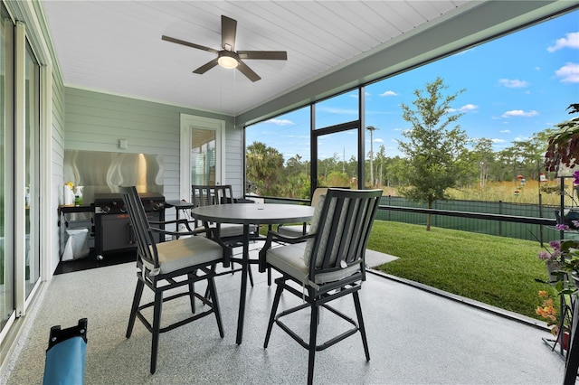 2137 Raglan Cir, Ormond Beach, FL 32174 - sunroom / solarium featuring a ceiling fan and outdoor dining area