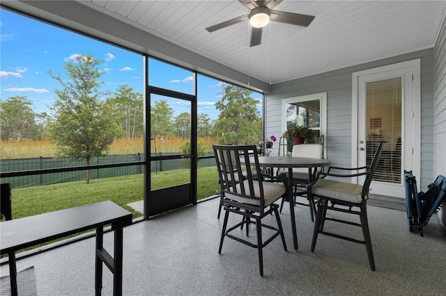 2137 Raglan Cir, Ormond Beach, FL 32174 - sunroom with a ceiling fan and outdoor dining area