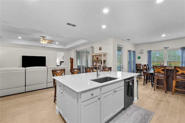 2137 Raglan Cir, Ormond Beach, FL 32174 - kitchen featuring stainless steel dishwasher, a kitchen island with sink, ceiling fan, recessed lighting, and white cabinets