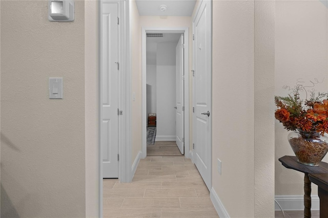 2137 Raglan Cir, Ormond Beach, FL 32174 - hallway with baseboards and a textured wall