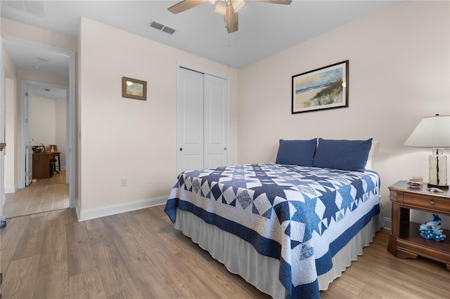 2137 Raglan Cir, Ormond Beach, FL 32174 - bedroom with a closet, wood finished floors, and ceiling fan