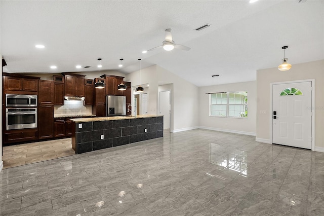 7 Zeolite Pl, Palm Coast, FL 32164 - kitchen featuring stainless steel appliances, under cabinet range hood, lofted ceiling, tasteful backsplash, and a ceiling fan