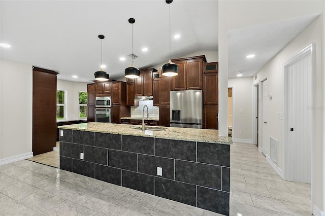7 Zeolite Pl, Palm Coast, FL 32164 - kitchen featuring stainless steel appliances, dark brown cabinets, light stone countertops, under cabinet range hood, and decorative light fixtures