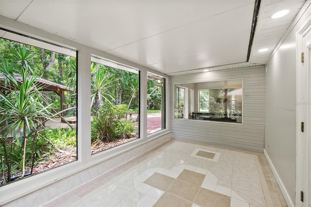 7 Zeolite Pl, Palm Coast, FL 32164 - unfurnished sunroom with recessed lighting and tile patterned floors