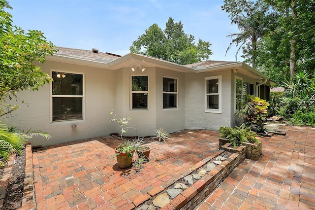 7 Zeolite Pl, Palm Coast, FL 32164 - rear view of house with stucco siding and a patio area