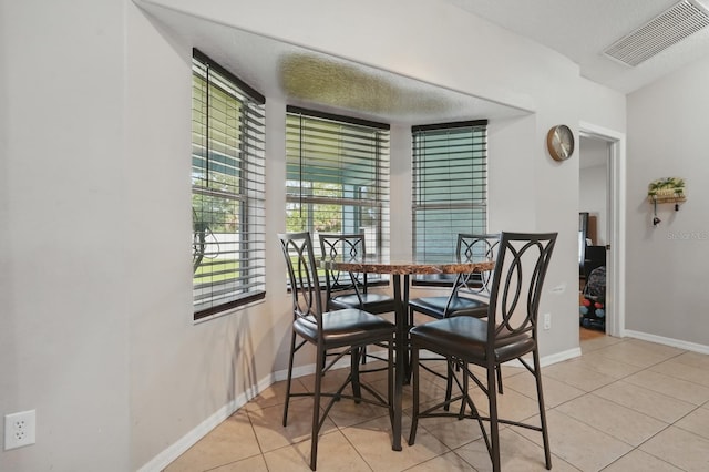 8 Severn Ct, Palm Coast, FL 32164 - dining space featuring light tile patterned flooring