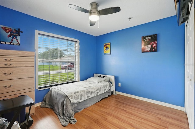 8 Severn Ct, Palm Coast, FL 32164 - bedroom with light wood finished floors and a ceiling fan