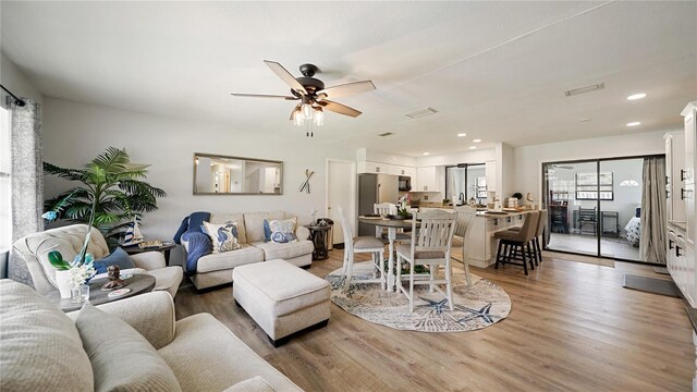 29 Firtree Ln, Palm Coast, FL 32137 - living room featuring light wood-style floors, a ceiling fan, and recessed lighting