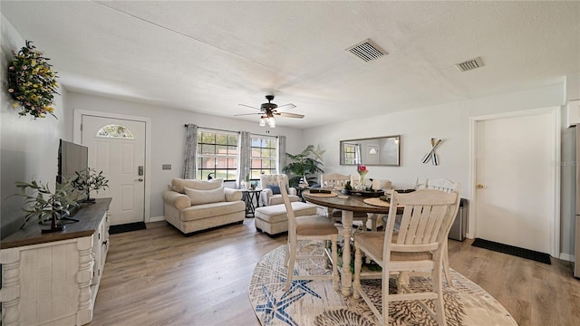 29 Firtree Ln, Palm Coast, FL 32137 - dining space with ceiling fan, light wood-type flooring, and a textured ceiling