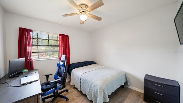 29 Firtree Ln, Palm Coast, FL 32137 - bedroom with wood finished floors, a desk, and a ceiling fan