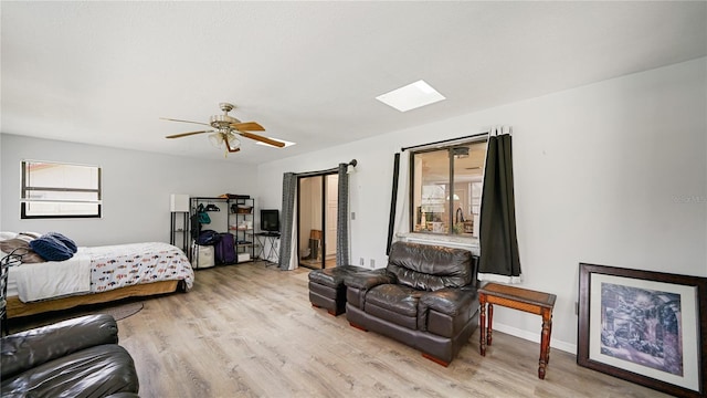 29 Firtree Ln, Palm Coast, FL 32137 - bedroom featuring light wood finished floors, a skylight, and a ceiling fan