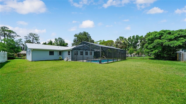 29 Firtree Ln, Palm Coast, FL 32137 - back of house with a metal roof, a lanai, and stucco siding