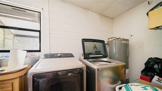 29 Firtree Ln, Palm Coast, FL 32137 - washroom with electric water heater, washer and dryer, healthy amount of natural light, and a textured ceiling