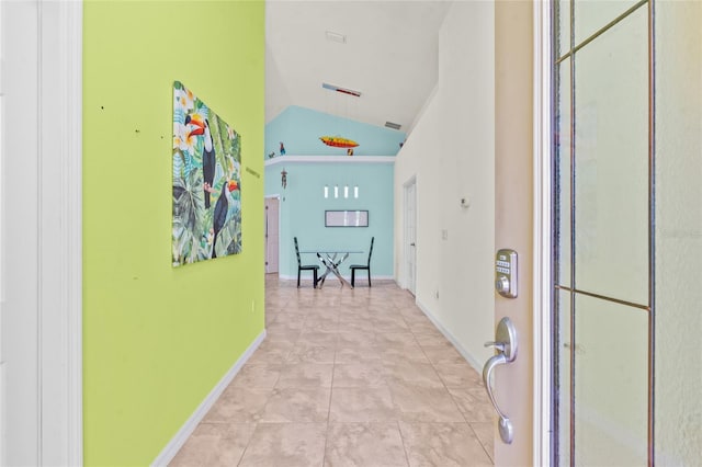 34 Raintree Cir, Palm Coast, FL 32164 - hall featuring lofted ceiling and tile patterned floors