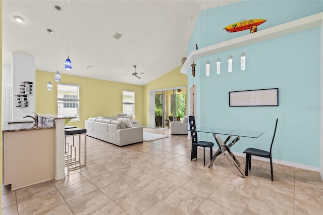 34 Raintree Cir, Palm Coast, FL 32164 - living room with ceiling fan, high vaulted ceiling, and light tile patterned floors