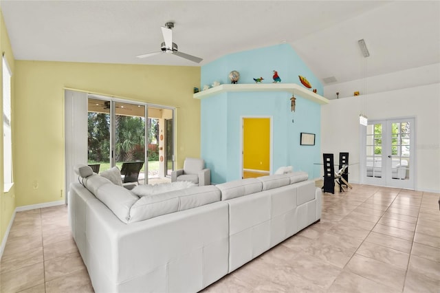 34 Raintree Cir, Palm Coast, FL 32164 - living room featuring vaulted ceiling, french doors, ceiling fan, and light tile patterned flooring