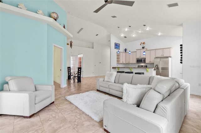 34 Raintree Cir, Palm Coast, FL 32164 - living room featuring a ceiling fan, high vaulted ceiling, and light tile patterned floors