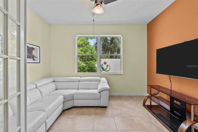 34 Raintree Cir, Palm Coast, FL 32164 - living room with a ceiling fan and light tile patterned floors