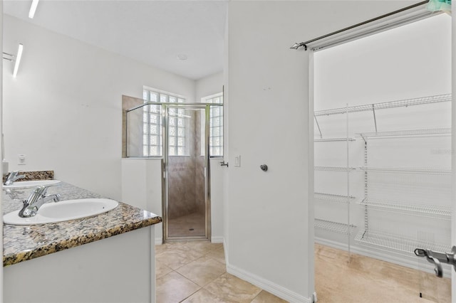 34 Raintree Cir, Palm Coast, FL 32164 - full bath featuring a stall shower, double vanity, and a walk in closet