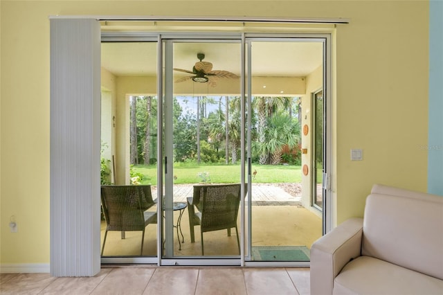 34 Raintree Cir, Palm Coast, FL 32164 - doorway with plenty of natural light, light tile patterned floors, and ceiling fan