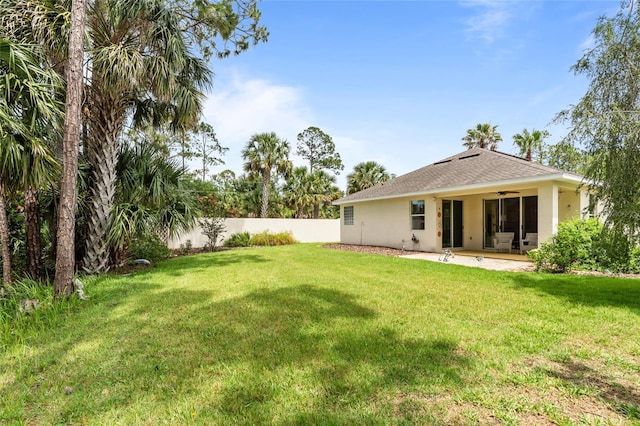34 Raintree Cir, Palm Coast, FL 32164 - view of yard with ceiling fan and a patio area