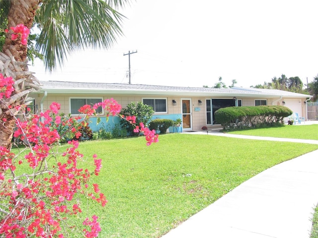 39 Benjamin Dr, Ormond Beach, FL 32176 - ranch-style home featuring a front lawn and a garage