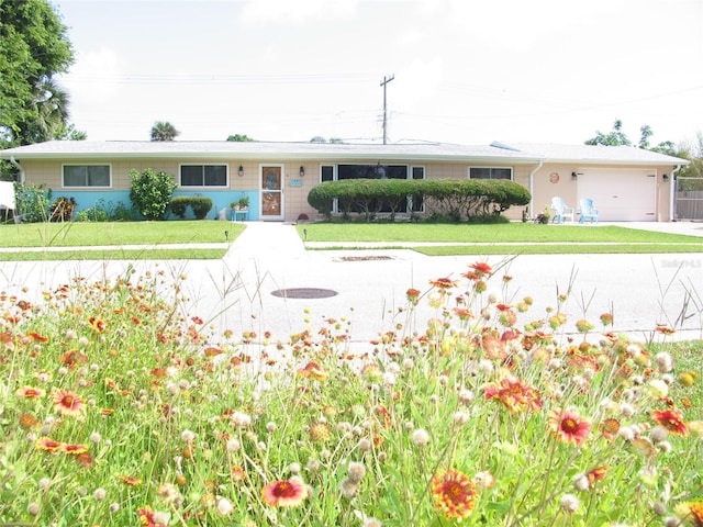 39 Benjamin Dr, Ormond Beach, FL 32176 - ranch-style house featuring an attached garage, a front lawn, and concrete driveway