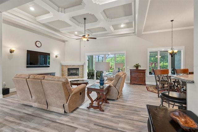 4 Midden Ln, Palm Coast, FL 32137 - living area with a ceiling fan, coffered ceiling, a high ceiling, a chandelier, and a fireplace