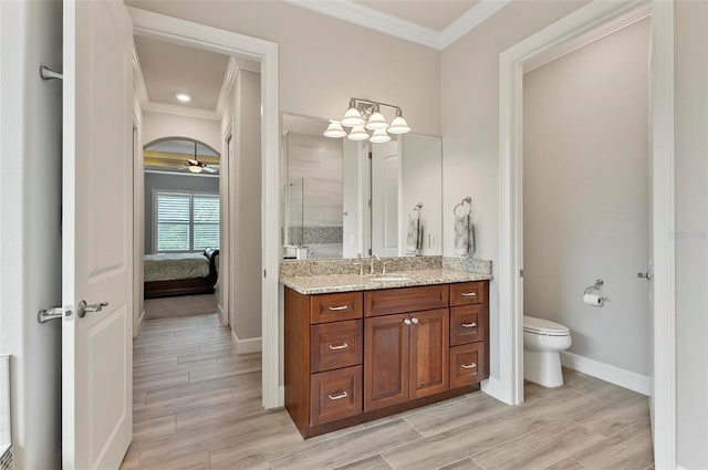 4 Midden Ln, Palm Coast, FL 32137 - bathroom with ornamental molding, vanity, a stall shower, wood finished floors, and ceiling fan