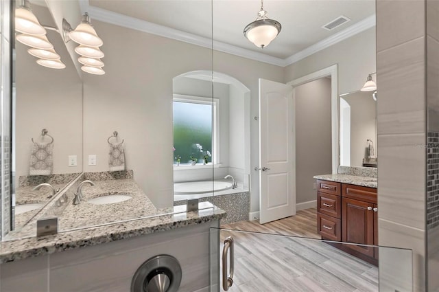 4 Midden Ln, Palm Coast, FL 32137 - full bath featuring two vanities, ornamental molding, wood finished floors, and a bath