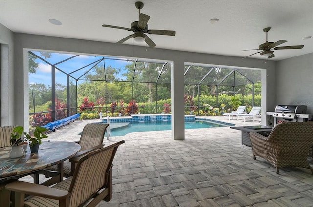 4 Midden Ln, Palm Coast, FL 32137 - outdoor pool featuring ceiling fan, a patio area, and glass enclosure