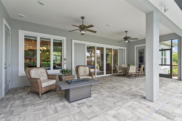4 Midden Ln, Palm Coast, FL 32137 - view of patio featuring a ceiling fan, a fire pit, and outdoor dining space