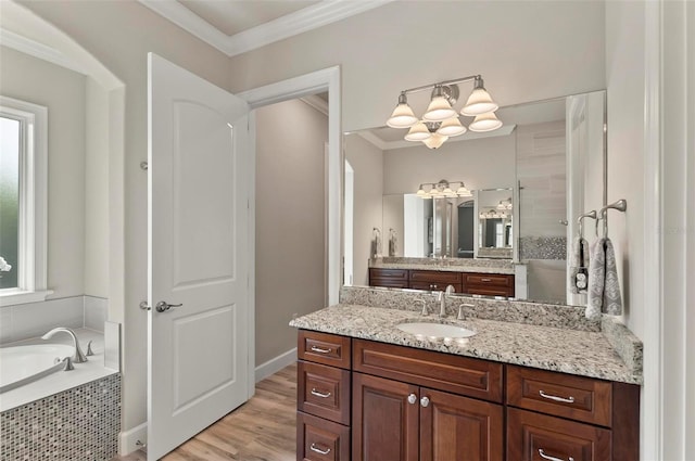 4 Midden Ln, Palm Coast, FL 32137 - full bathroom featuring vanity, a chandelier, a bath, ornamental molding, and wood finished floors