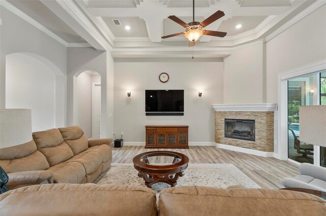 4 Midden Ln, Palm Coast, FL 32137 - living area featuring coffered ceiling, light wood-style flooring, arched walkways, a ceiling fan, and crown molding