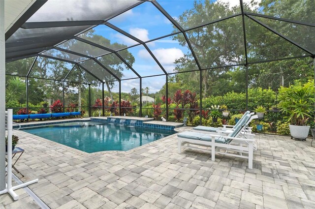 4 Midden Ln, Palm Coast, FL 32137 - swimming pool featuring a patio and a lanai