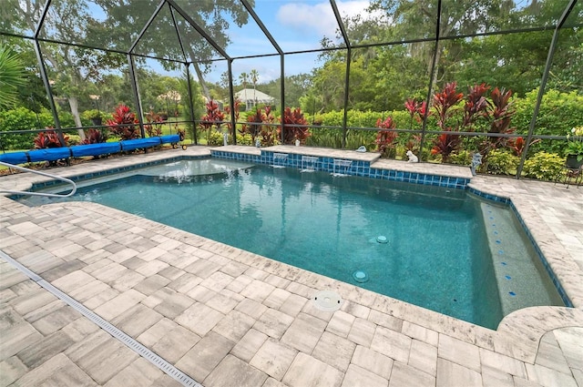 4 Midden Ln, Palm Coast, FL 32137 - swimming pool with a patio area and glass enclosure
