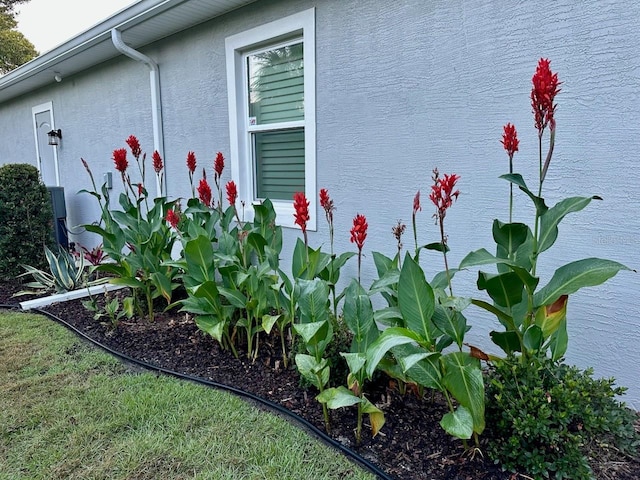 4 Midden Ln, Palm Coast, FL 32137 - view of property exterior with stucco siding