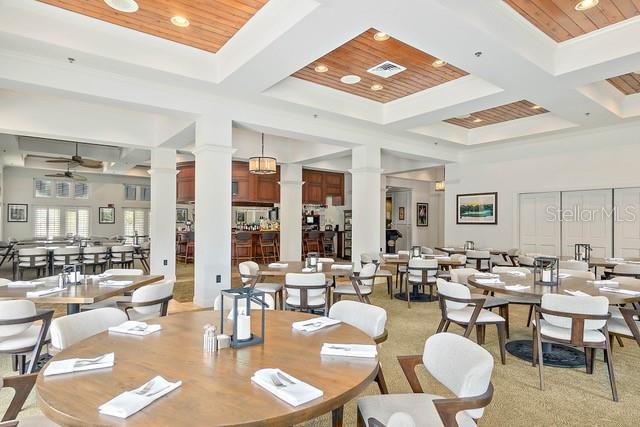 4 Midden Ln, Palm Coast, FL 32137 - dining area with ornate columns, coffered ceiling, a high ceiling, recessed lighting, and a ceiling fan