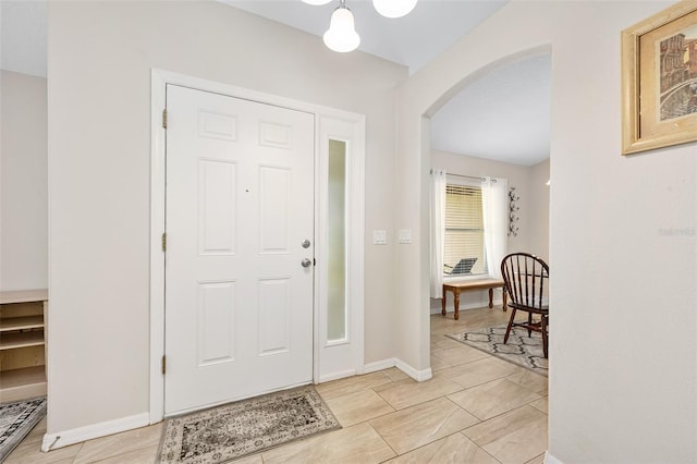22 Post Tree Ln, Palm Coast, FL 32164 - foyer entrance with arched walkways and baseboards