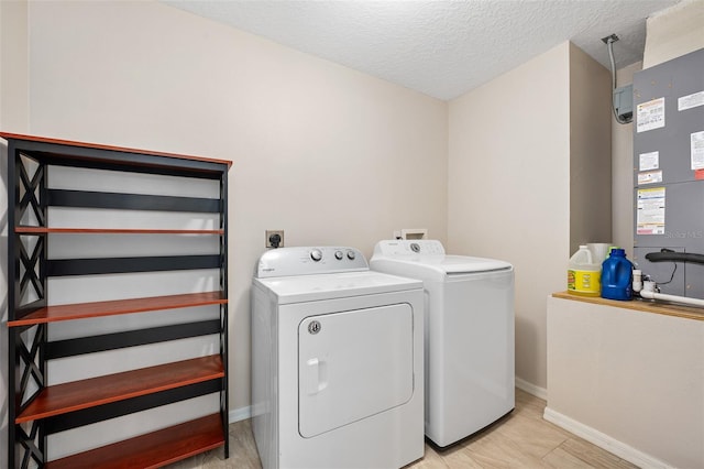 22 Post Tree Ln, Palm Coast, FL 32164 - laundry room with independent washer and dryer, heating unit, and a textured ceiling