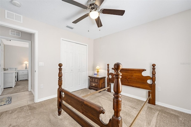 22 Post Tree Ln, Palm Coast, FL 32164 - bedroom featuring light colored carpet, a closet, and a ceiling fan