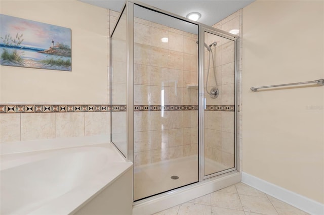 200 Ocean Crest Dr Unit 913, Palm Coast, FL 32137 - bathroom with a shower stall, a garden tub, and tile patterned flooring