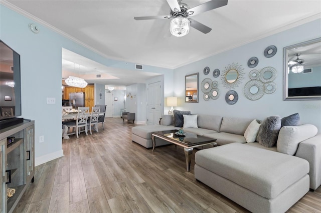 200 Ocean Crest Dr Unit 913, Palm Coast, FL 32137 - living room with a ceiling fan, ornamental molding, and light wood-style floors