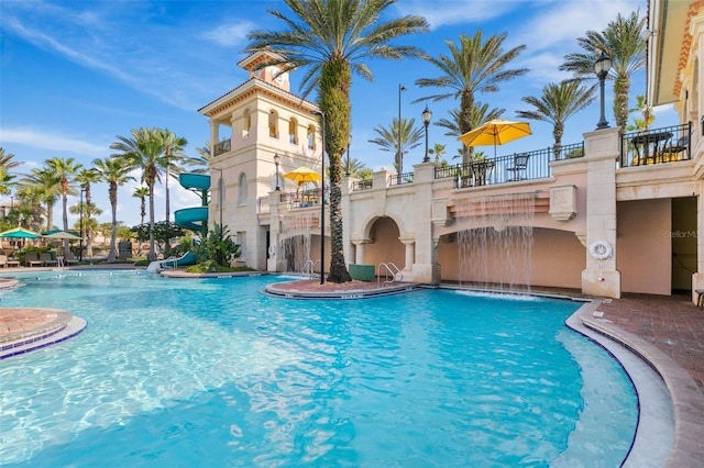 200 Ocean Crest Dr Unit 913, Palm Coast, FL 32137 - community pool featuring a water slide